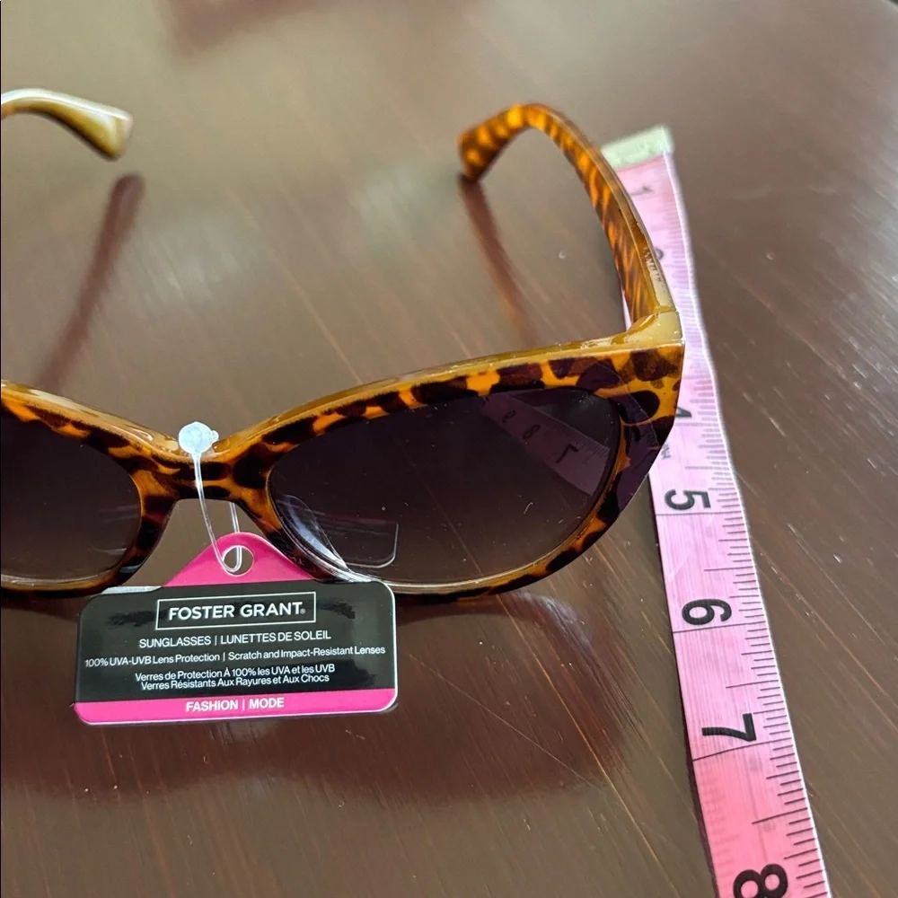 Foster Grant 100% UVA-UVB protection leopard print, gold tone beaded frame edge